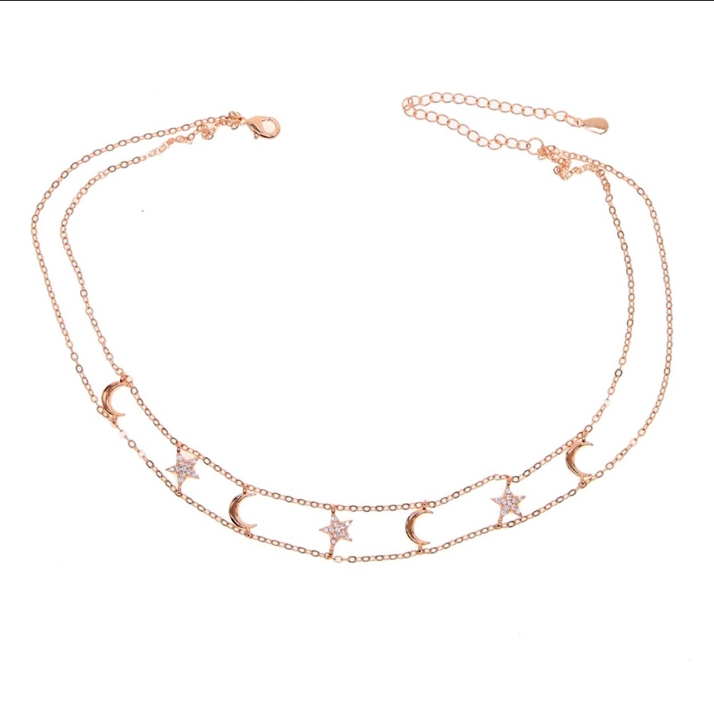 Reach for this moon-star choker when layering on the shimmer.